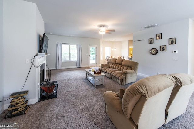 living room featuring carpet floors and ceiling fan