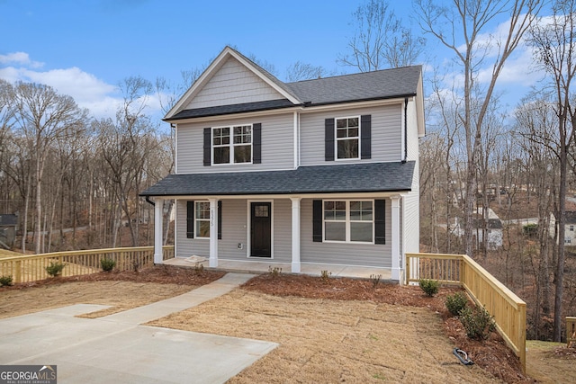 front facade featuring a front lawn and a porch