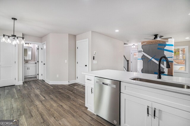 living room with ceiling fan, sink, and dark wood-type flooring