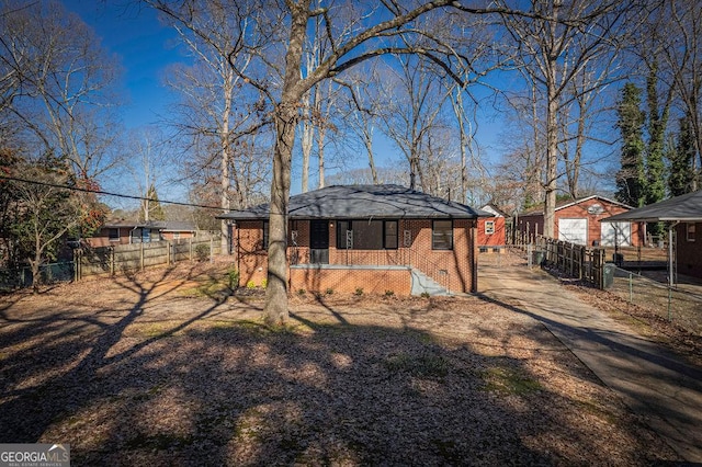 rear view of house with a garage