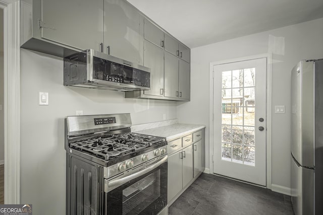 kitchen featuring gray cabinets and appliances with stainless steel finishes