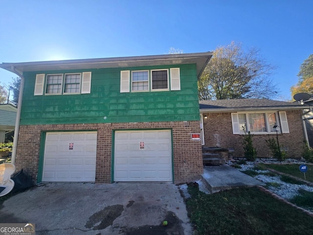 split level home featuring a garage