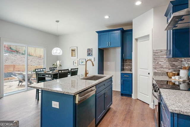 kitchen featuring blue cabinetry, electric range oven, stainless steel dishwasher, a sink, and wall chimney exhaust hood