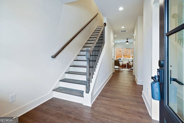 entrance foyer featuring baseboards, visible vents, wood finished floors, and recessed lighting