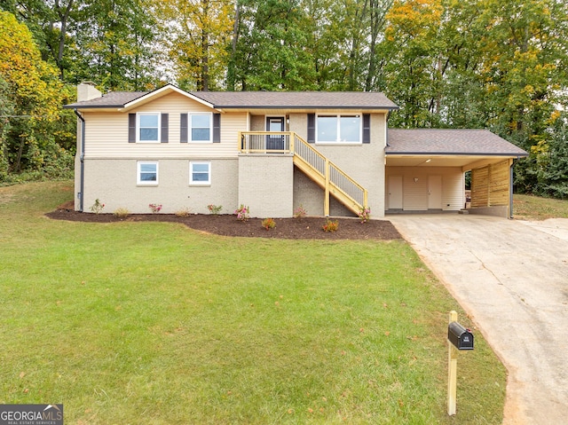 view of front facade with a carport and a front yard