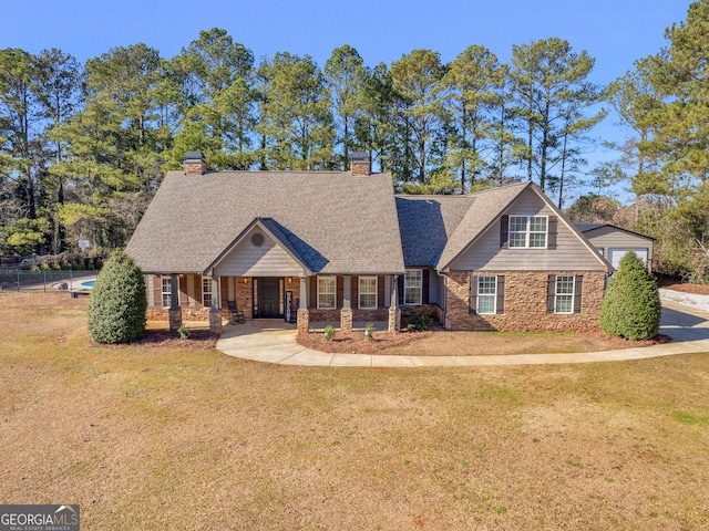 craftsman house with a front lawn and a porch