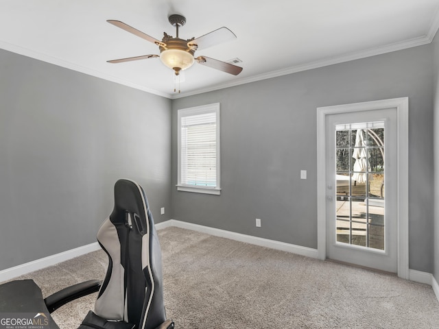 carpeted office space featuring ceiling fan, crown molding, and a wealth of natural light