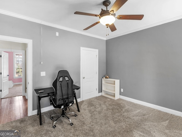 office featuring carpet, ceiling fan, and crown molding