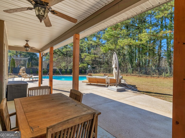 view of patio with pool water feature and ceiling fan