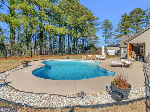 view of pool featuring a patio area