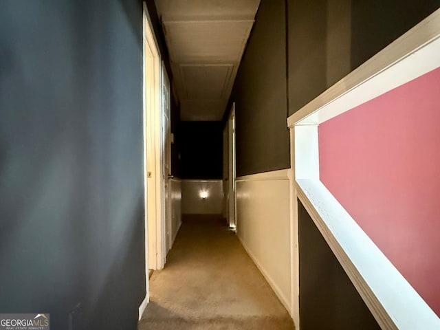 corridor featuring light colored carpet