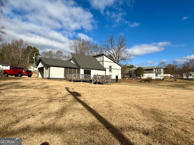 view of side of home with a deck