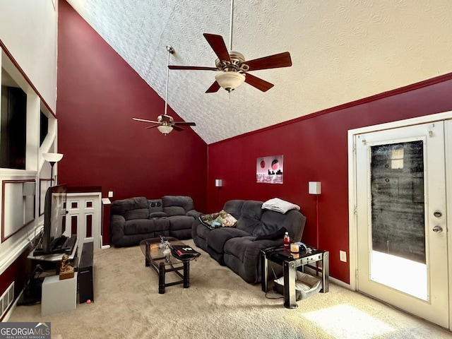 carpeted living room featuring ceiling fan and high vaulted ceiling