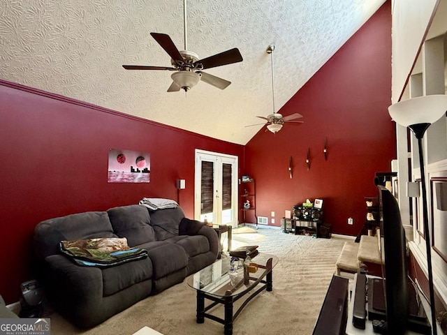 living room with high vaulted ceiling, french doors, ceiling fan, a textured ceiling, and carpet floors