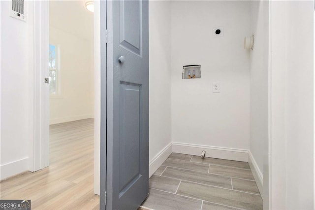 washroom featuring electric dryer hookup and washer hookup