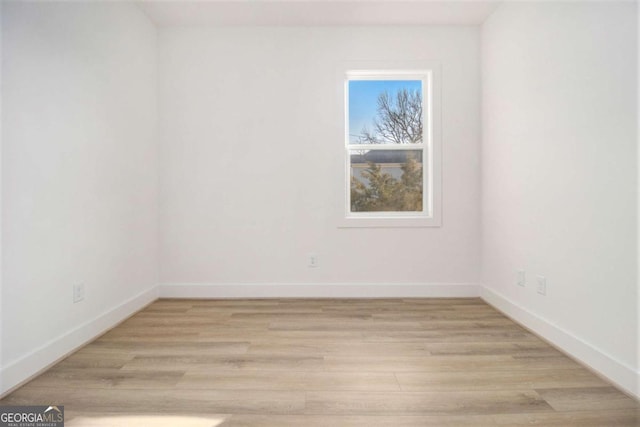 unfurnished room featuring light wood-type flooring