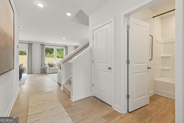 hall with light wood-type flooring