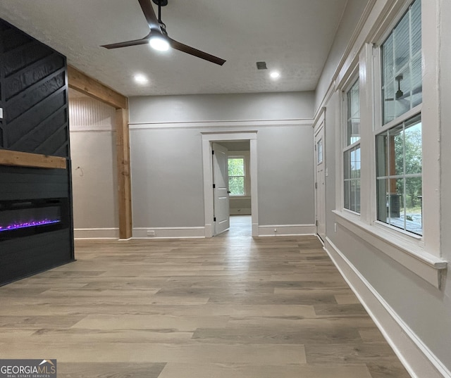 spare room with ceiling fan and light hardwood / wood-style flooring