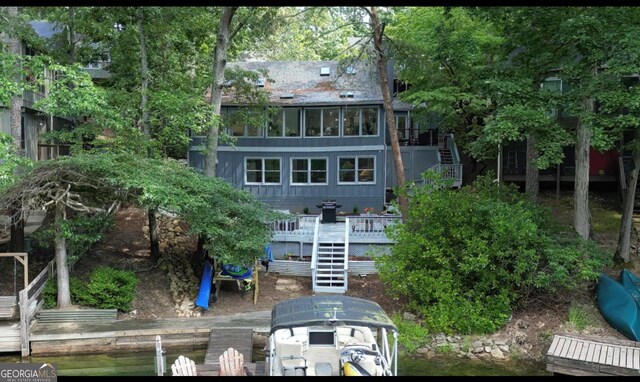 back of property featuring a deck