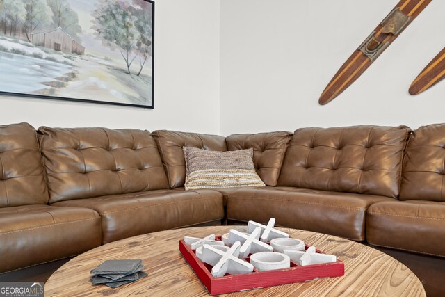 living room featuring beam ceiling