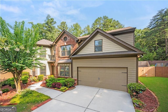 craftsman-style home featuring a front yard and a garage