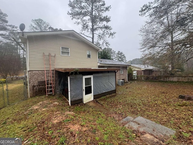 rear view of property featuring cooling unit