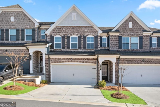 townhome / multi-family property featuring a garage