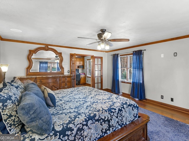 bedroom with ceiling fan, french doors, dark wood-type flooring, and ornamental molding