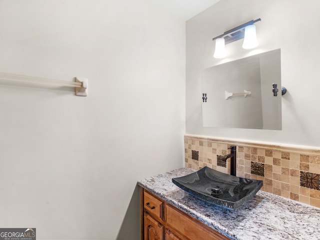 bathroom with vanity and backsplash