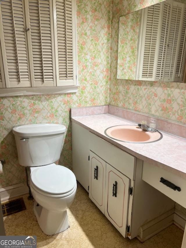 bathroom with vanity and toilet