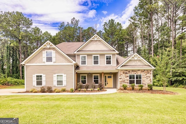 craftsman-style home with a front lawn