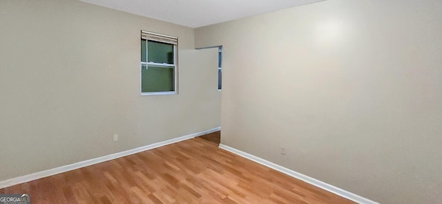 empty room featuring hardwood / wood-style floors