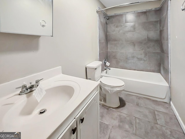 full bathroom featuring toilet, tile patterned floors, vanity, and tiled shower / bath combo