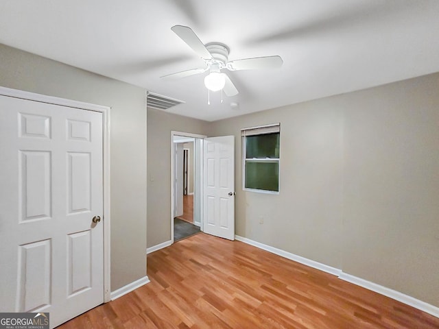 unfurnished bedroom with light hardwood / wood-style floors and ceiling fan