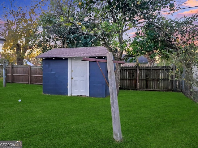 outdoor structure at dusk with a yard