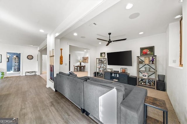 living room with hardwood / wood-style floors and ceiling fan