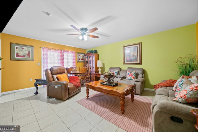 tiled living room with ceiling fan