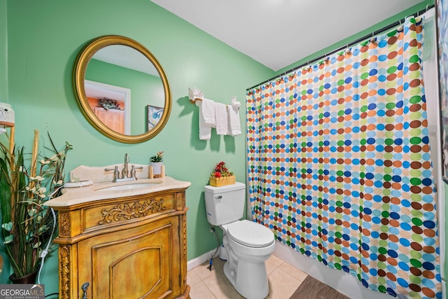 bathroom featuring toilet, vanity, tile patterned floors, and walk in shower