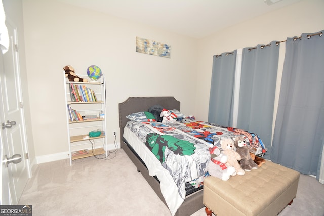 bedroom with light carpet