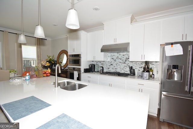 kitchen with sink, white cabinetry, stainless steel appliances, and tasteful backsplash