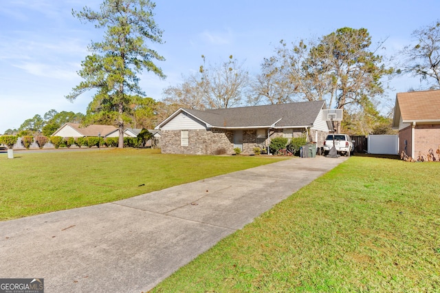 ranch-style home featuring a front yard