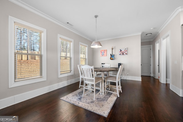 dining space featuring plenty of natural light, ornamental molding, and dark wood-type flooring