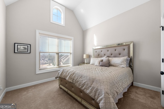 carpeted bedroom with lofted ceiling