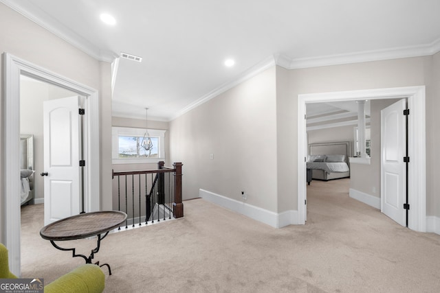 hall featuring light colored carpet, an inviting chandelier, and crown molding