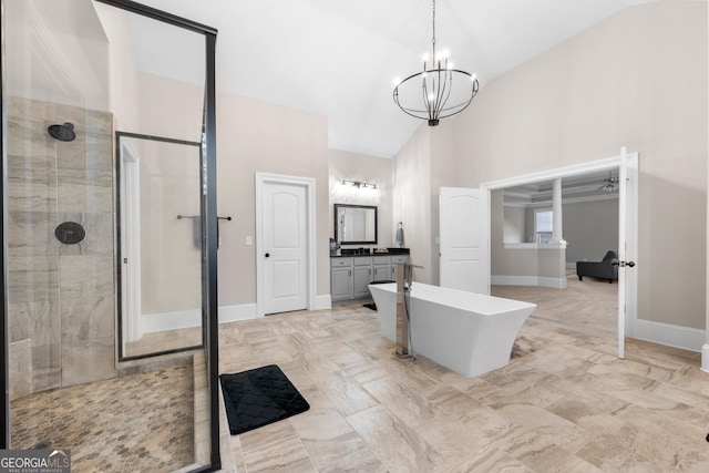 bathroom with a notable chandelier, vanity, separate shower and tub, and high vaulted ceiling