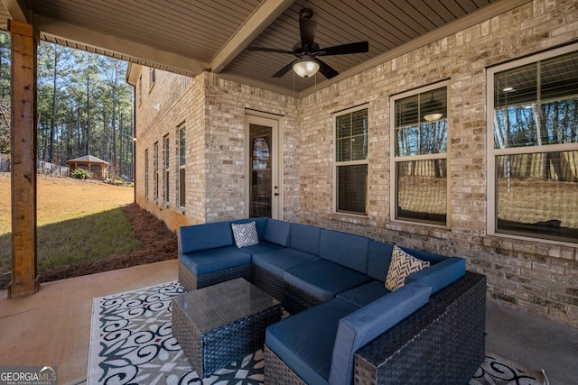 view of patio / terrace featuring an outdoor living space and ceiling fan