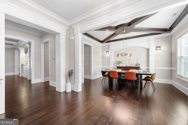 dining space with dark hardwood / wood-style floors, decorative columns, and ornamental molding