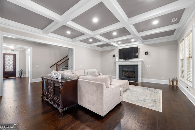 living room featuring beam ceiling, dark wood-type flooring, crown molding, and coffered ceiling