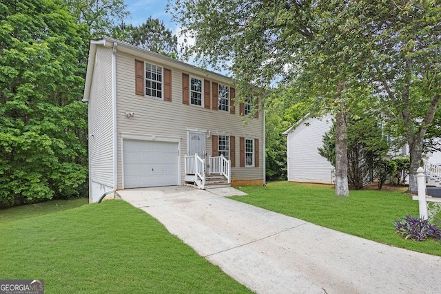 view of front of property featuring driveway, a garage, and a front yard