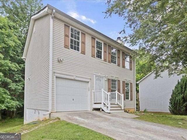 colonial inspired home with a garage